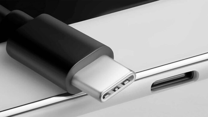 Κινητό με συνδεδεμένη θύρα USB‑C, καλώδια, SSD και DAC σε χρήση - θύρα USB-C κινητού ενεργή